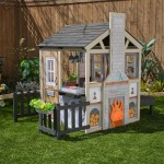 Casuta de joaca Cuptorul cu Lemne Kidkraft Cozy Hearth - Casa cu LEDuri pentru copii cu pridvor si bancute cu bucatarie si accesorii Cabin PlayHouse